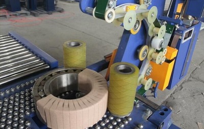 Close-up of bearing being wrapped by orbital stretch wrapper