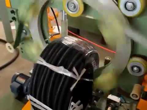 Cable wrapping machine and hydraulic tube packing machine