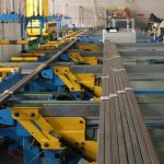 Aluminum sub-bundle transfer conveyor