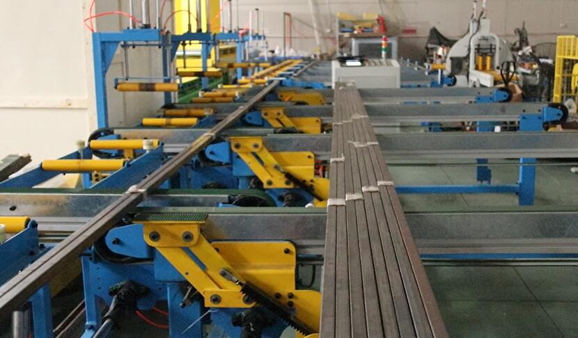 Aluminum sub-bundle transfer conveyor