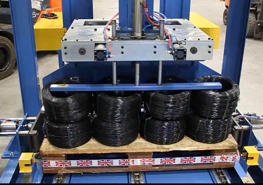 Cable coil stacking machine