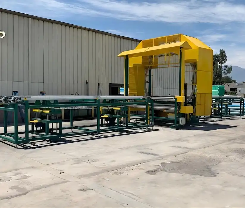 Master horizontal orbital wrapper machine model E2400 efficiently wrapping a long, potentially fragile product with stretch film.