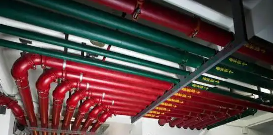 Industrial piping system showcasing various color codes according to industry practices.