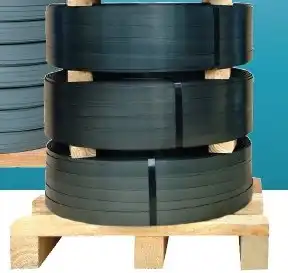 Worker Manually Strapping Coil