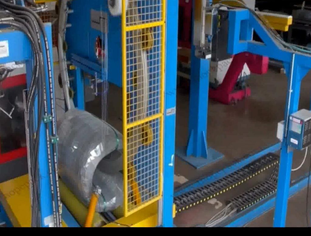 Automatic steel wire coil wrapping machine applying protective paper wrap