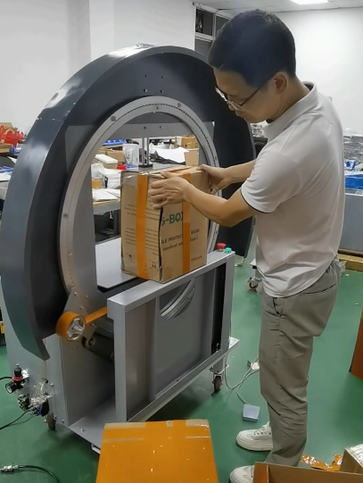 Box tapping machine