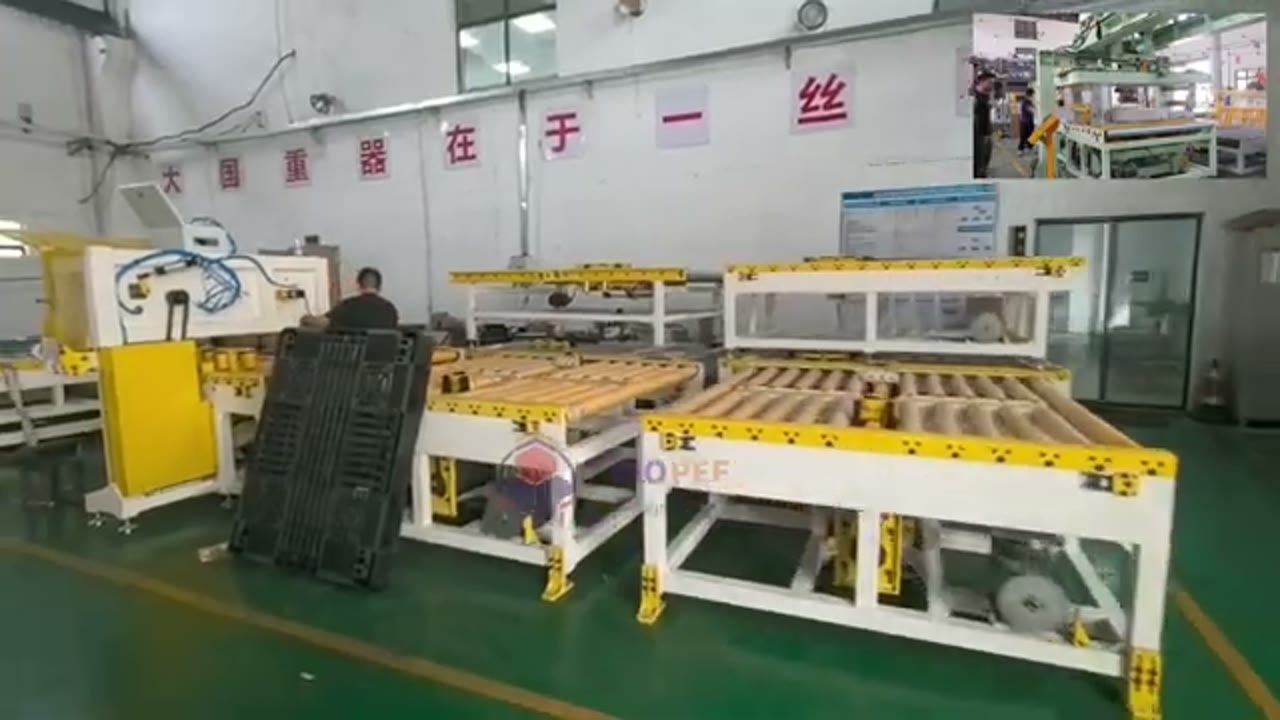 Wide view of the factory hall and several coil handling stations at the start of the reviewed clip