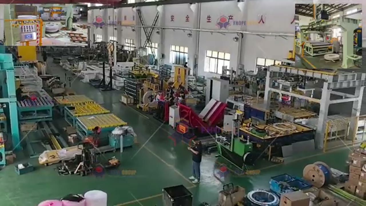 Factory hall with an operator standing beside the coil handling line during the reviewed clip