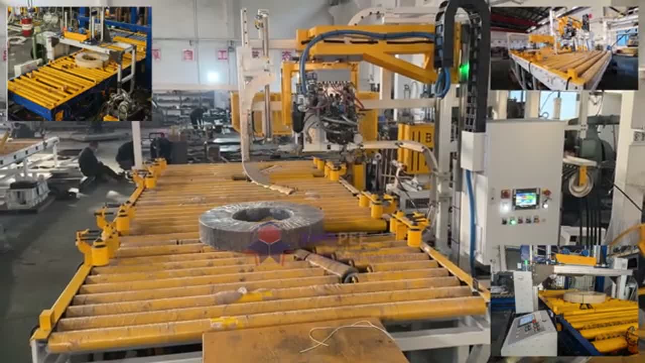 Yellow roller conveyor line with a robotic arm holding a steel coil, seen in the first frame of the reviewed clip