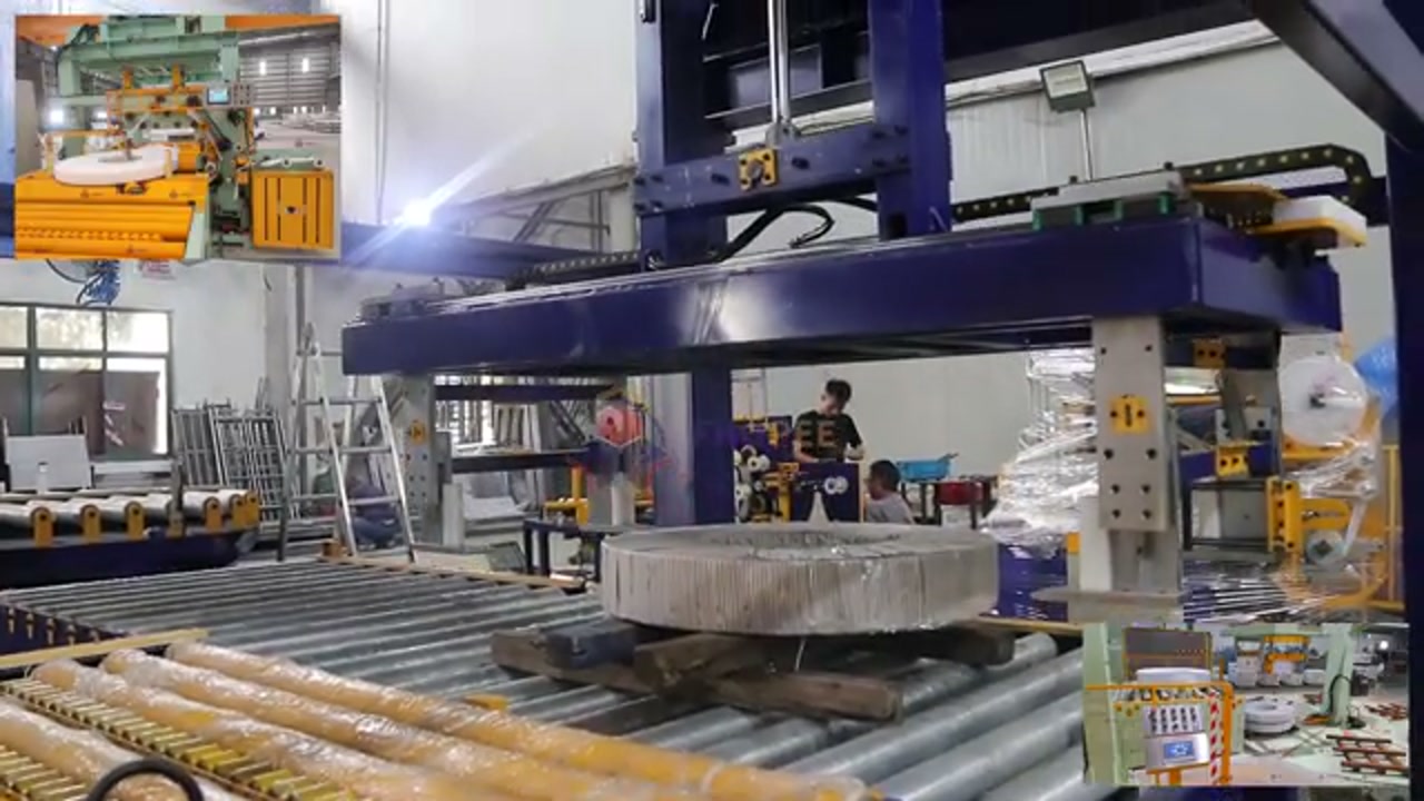 Steel coil lying flat on a wooden pallet on a roller conveyor under a blue overhead machine