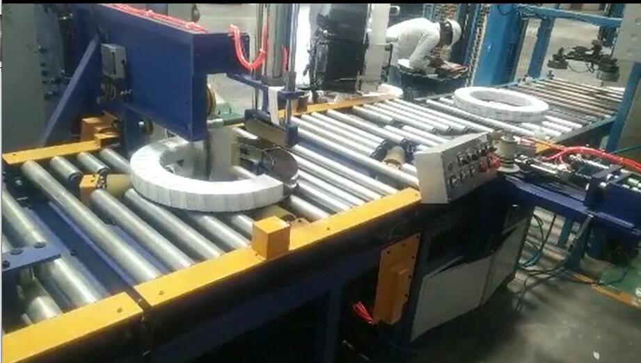 automatic tapping and wrapping machine for coil